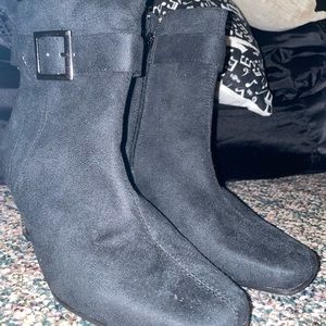 Black suede booties with buckle accent and heels. Never been worn.